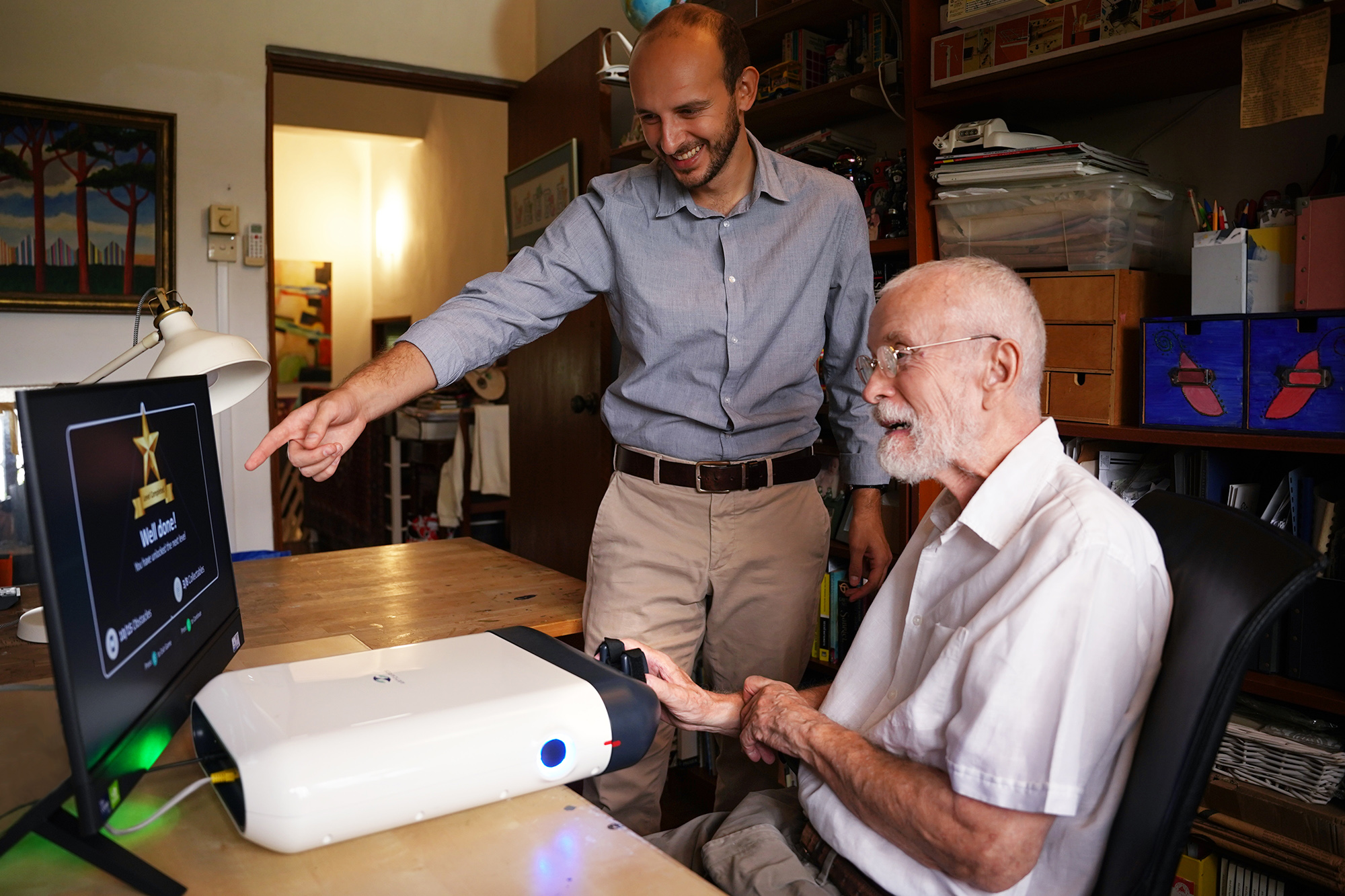 A patient using the ReHandyBot in his home (Singapore).